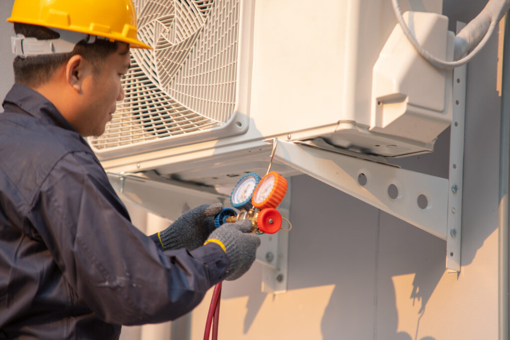 Technician are repairing air handler unit